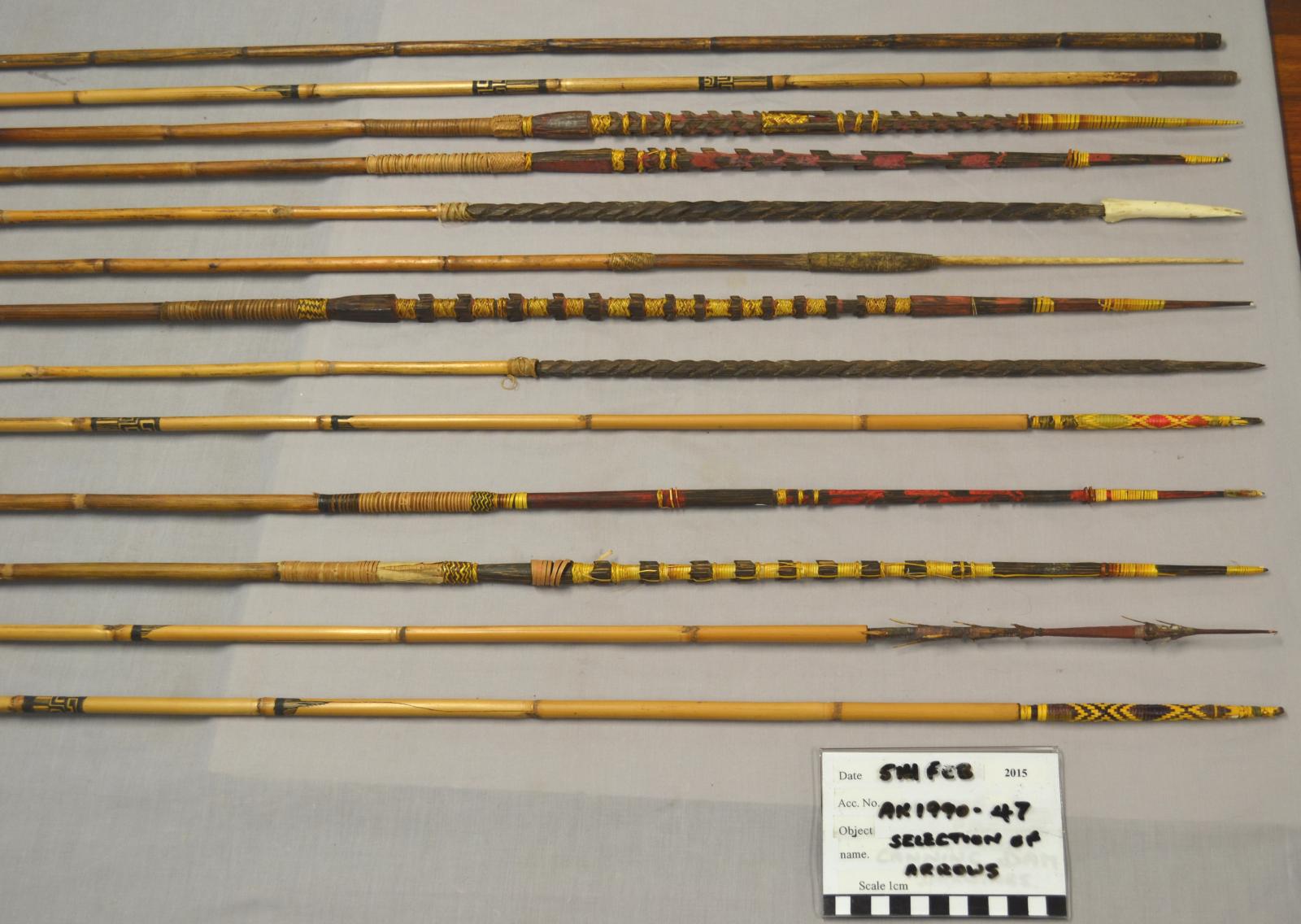 Collection of thirteen bamboo spears of various designs and sizes. 