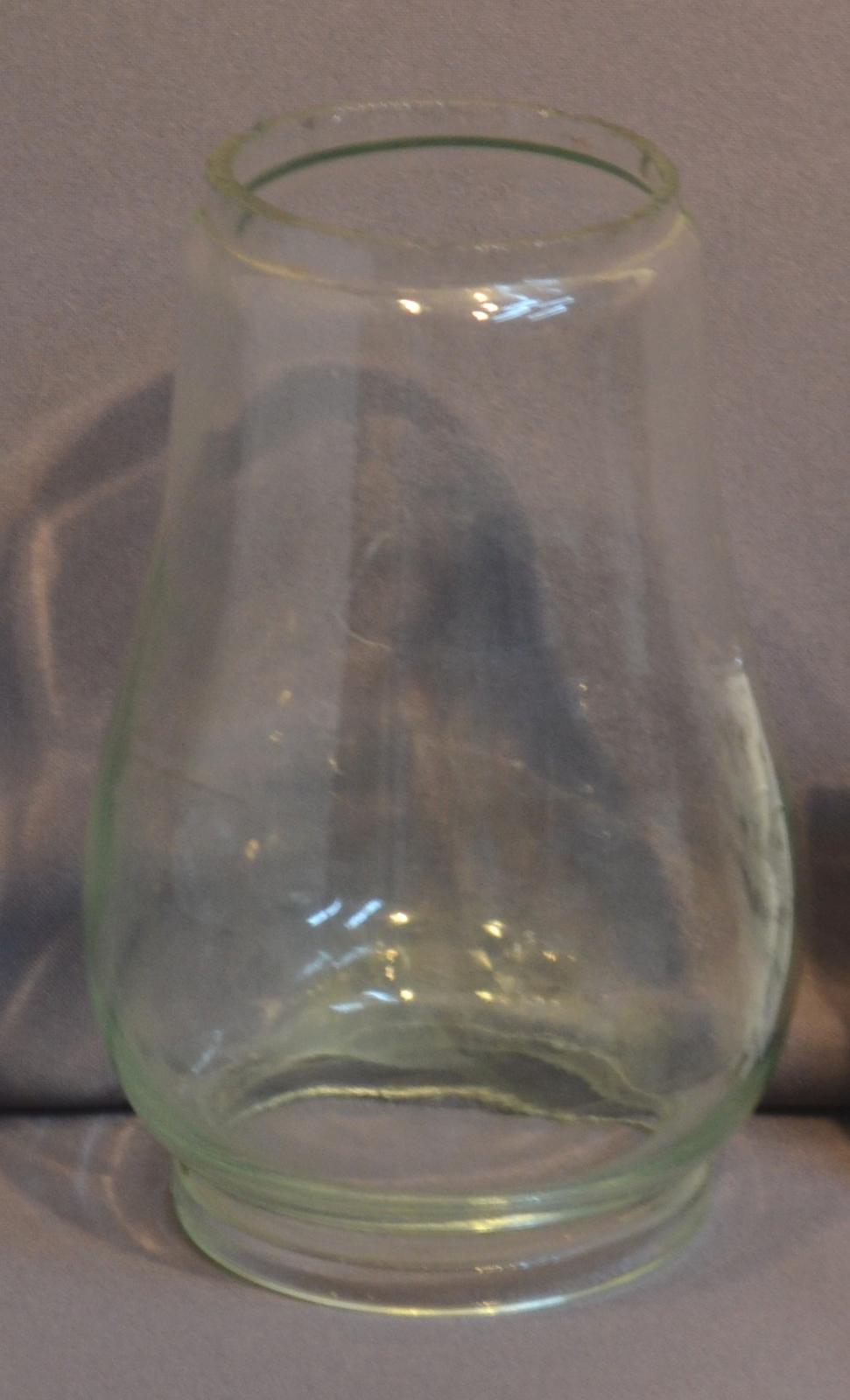 Lamp globe, cylindrical, open at both ends and tapering towards the top which ends in a lip.