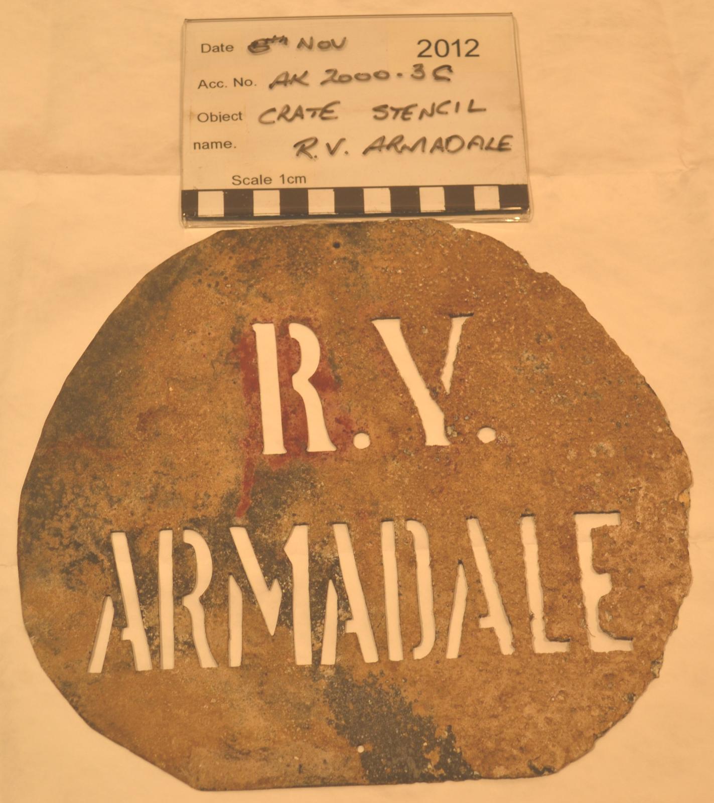 Round metal stencil with text R.V. Armadale cut out