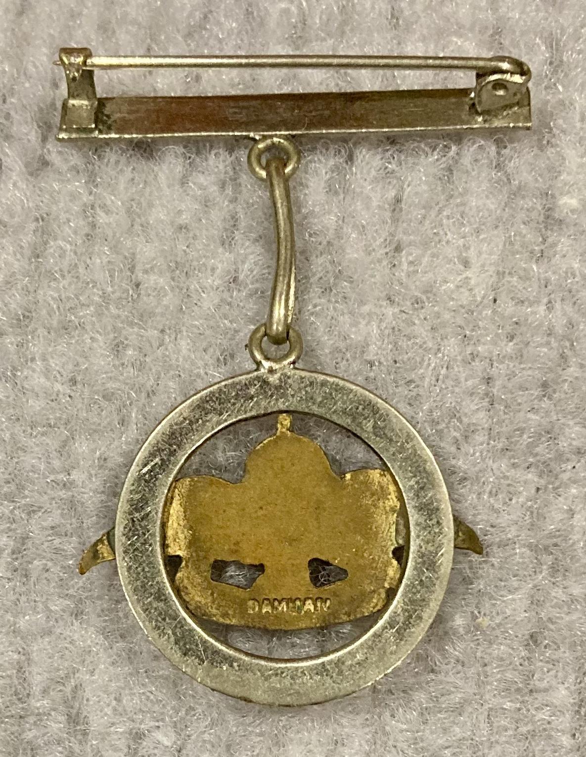 Reverse of Royal Australian Air Force silver tone sweetheart brooch in form of circle suspended from bar