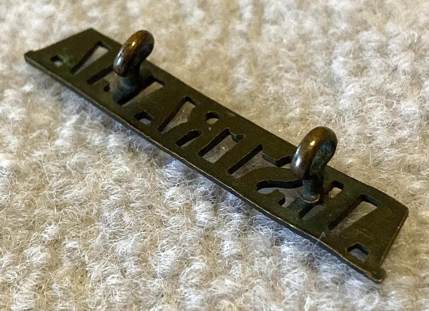 Angled view of reverse of straight Australia metal shoulder title - 2