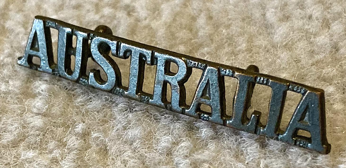 Angled view of straight Australia metal shoulder title - 2