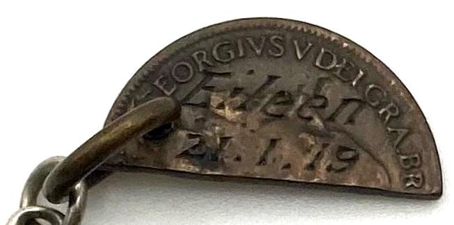 Close-up of engraving on love token