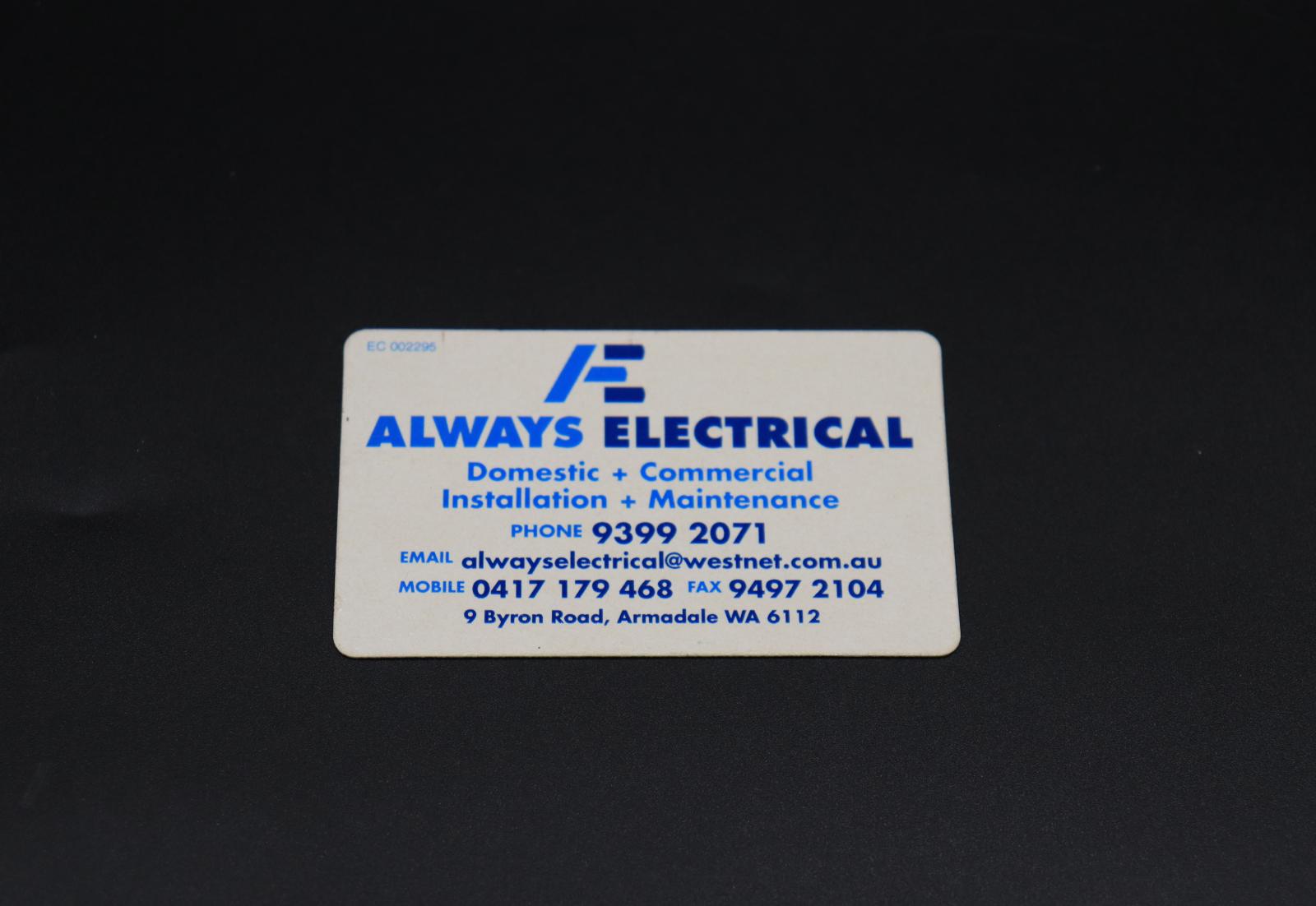 A small, white and blue fridge magnet advertising for Always Electrical