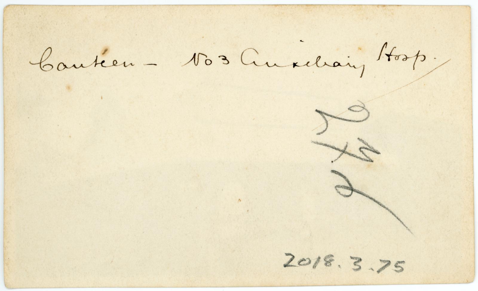 Rear view showing inscription.