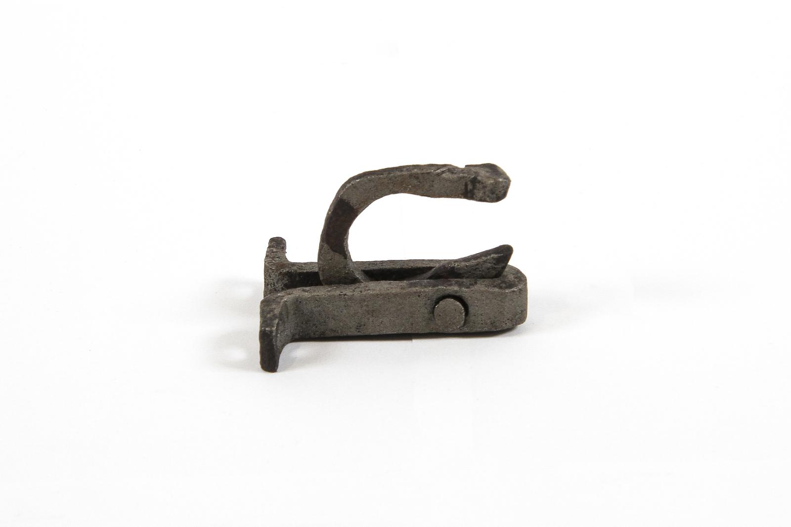 gate latch resting on mounting bracket