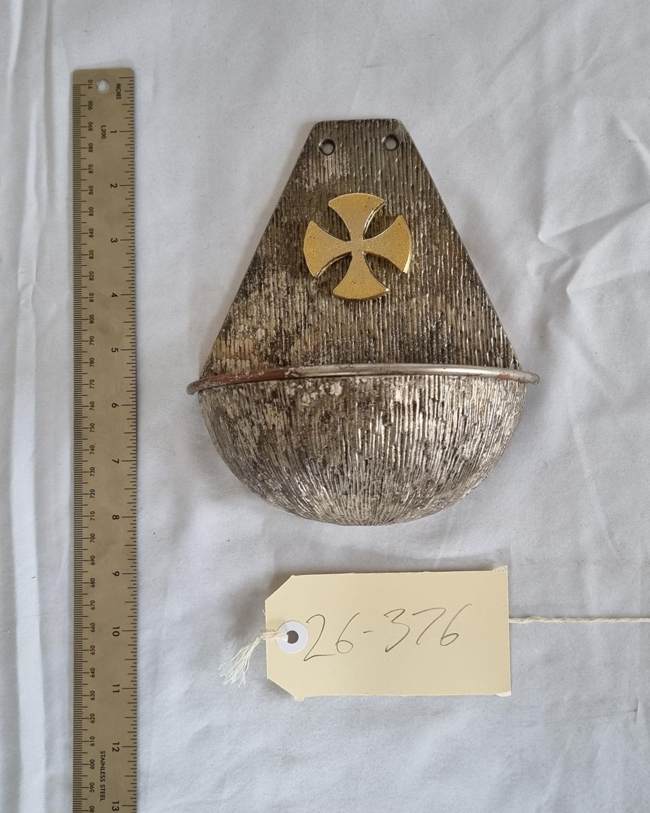 26-376 Metal (potentially copper) stoup photo with scale and tag.