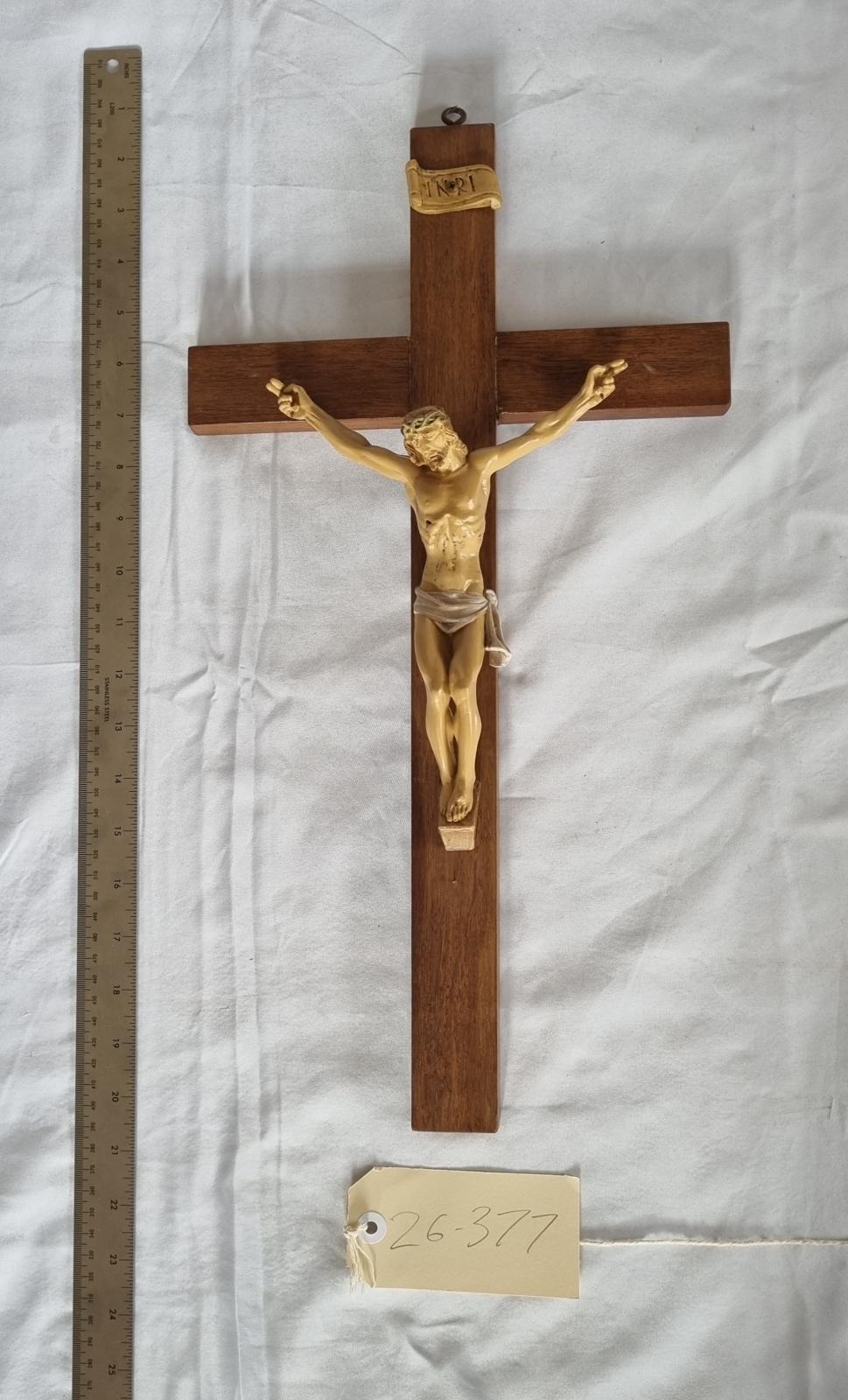 26-377 Wooden Crucifix with a plastic-molded Jesus photo with scale and tag.