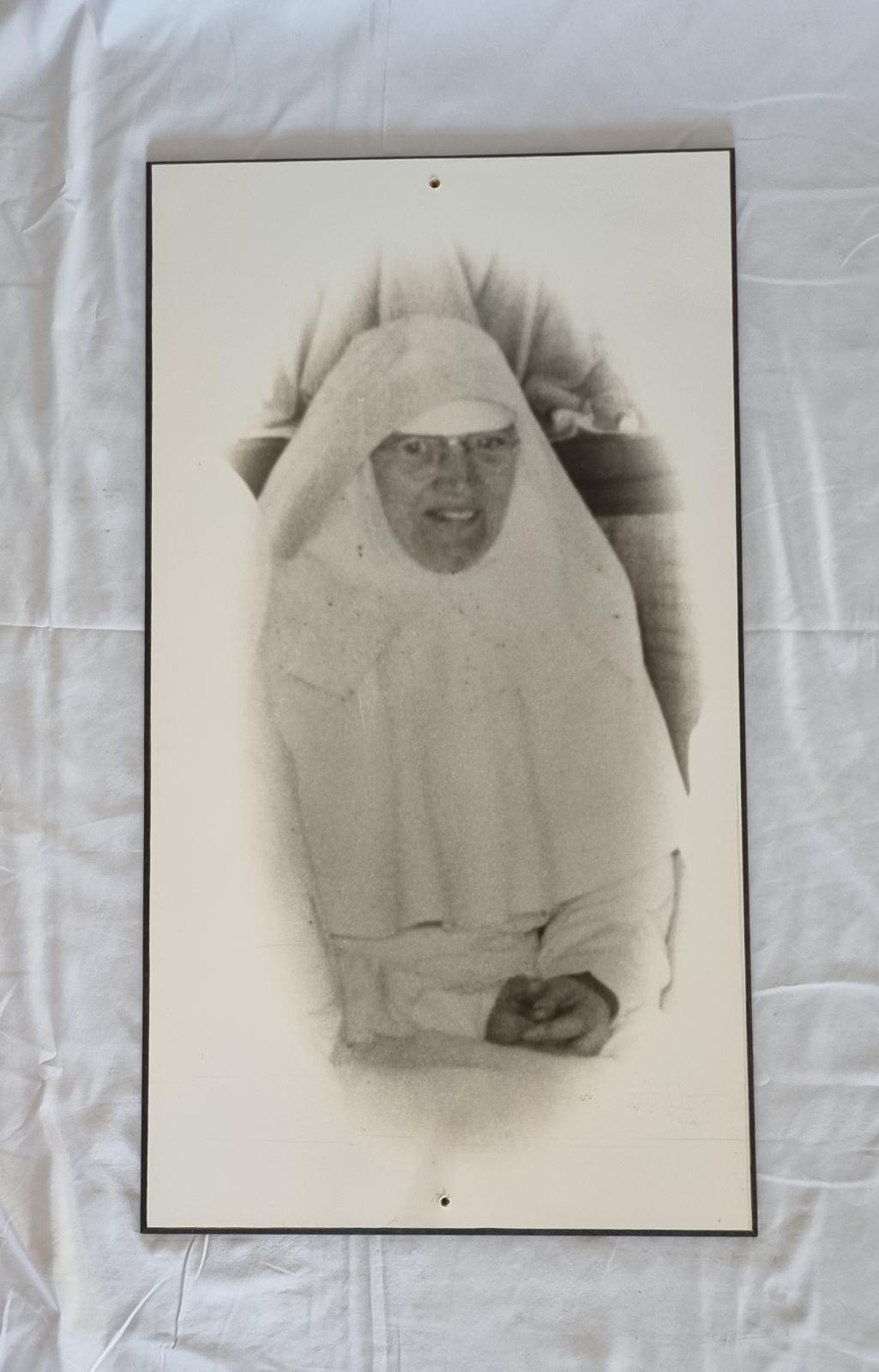 26-379.1 Large black and white portrait of Sister Rosanne Fox RSM photo with background front-view.