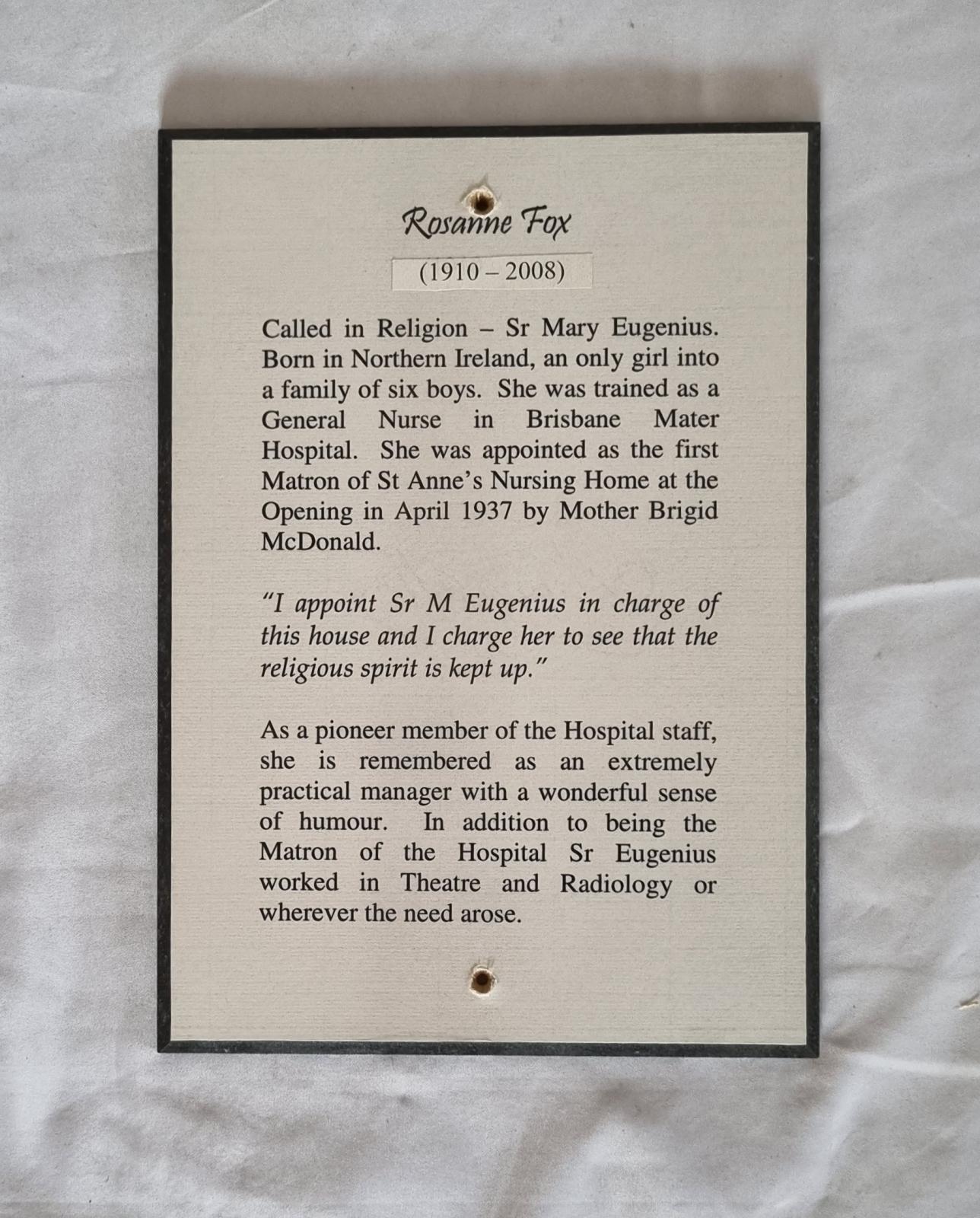 26-379.2 Woodblock-print of description of Sister Rosanne Fox RSM photo with background front-view.