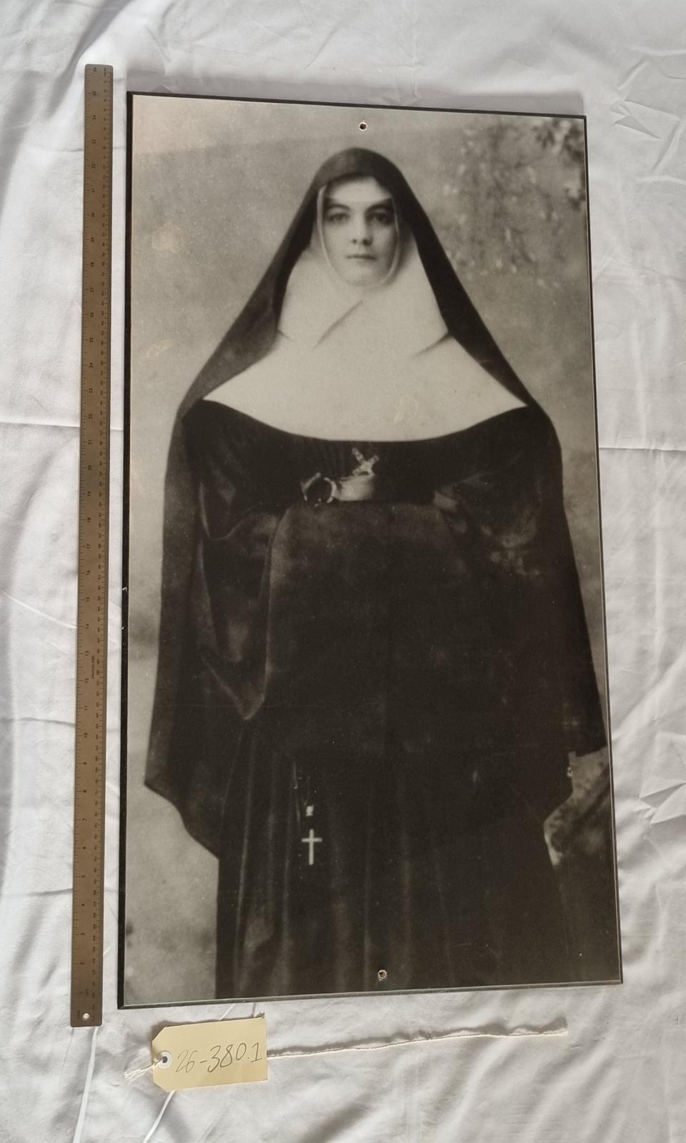 26-380.1 Large black and white portrait of Mother Brigid McDonald RSM photo with scale and tag.