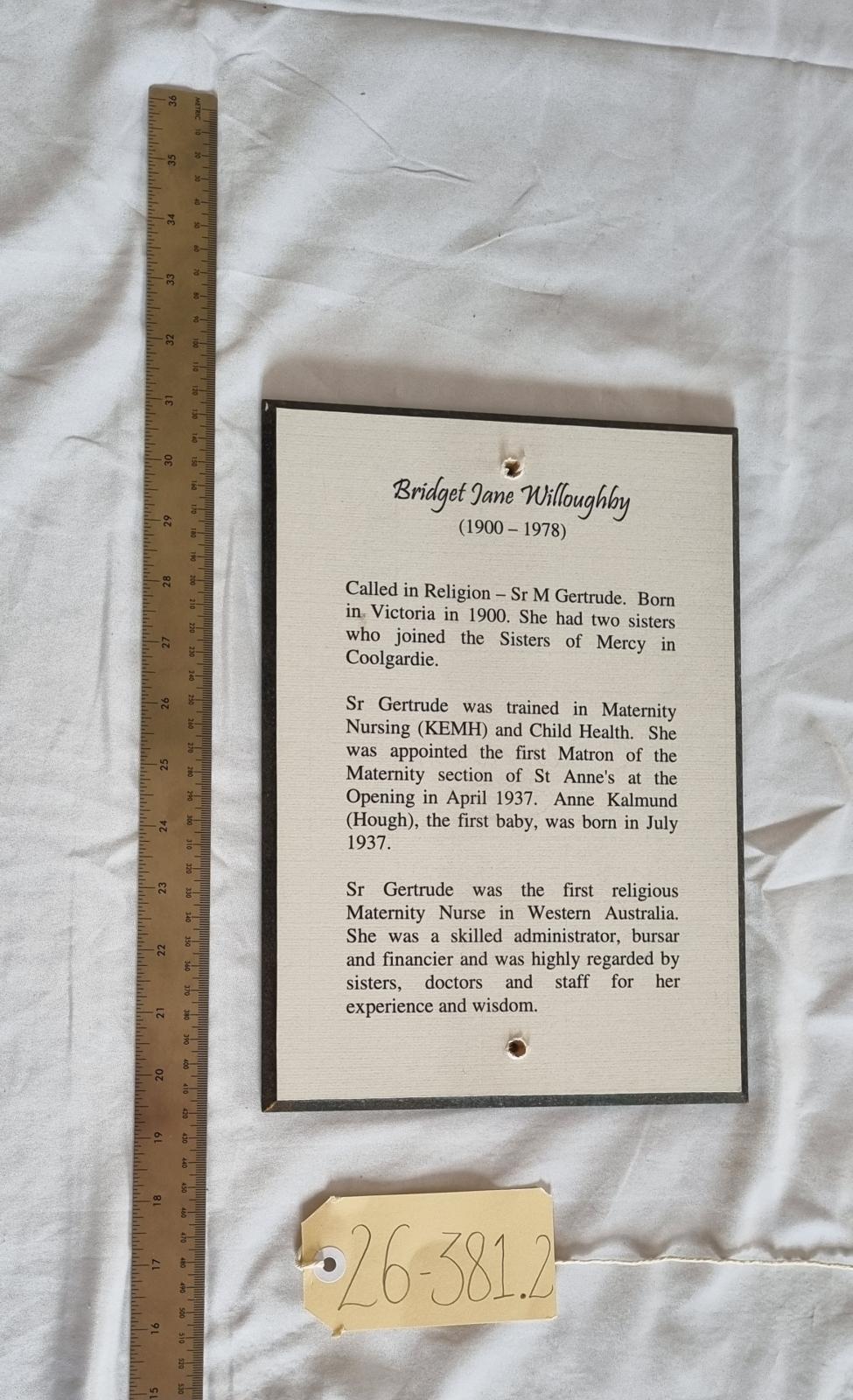 26-381.2 Woodblock-print of description of Bridget Jane (Sister Gertrude) Willoughby RSM photo with scale and tag. 