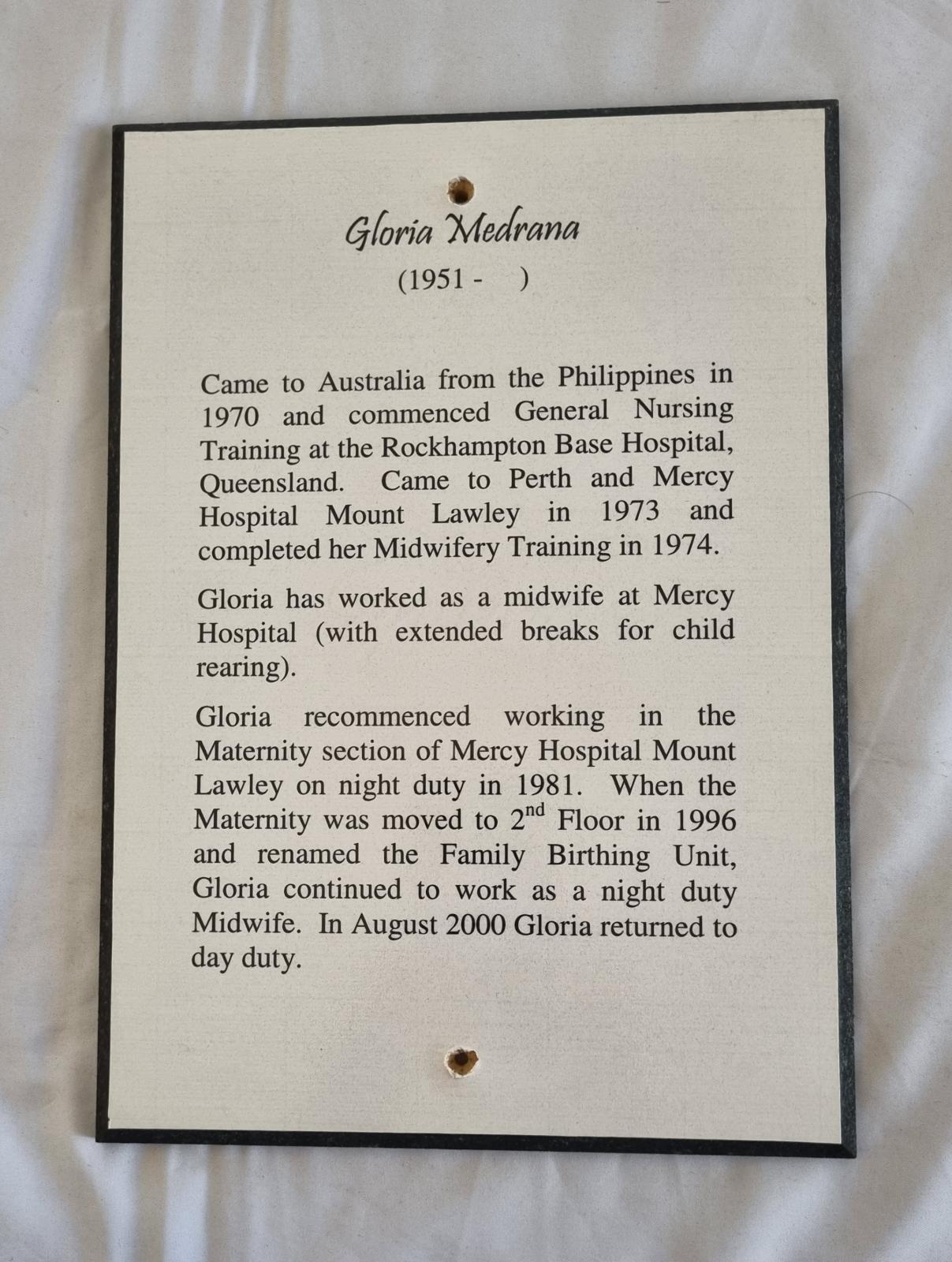 26-382.2 Woodblock-print of description of Gloria Medrana photo with background.