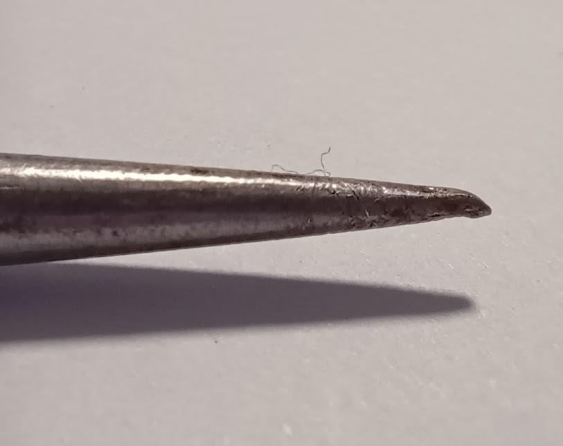 tip of an awl