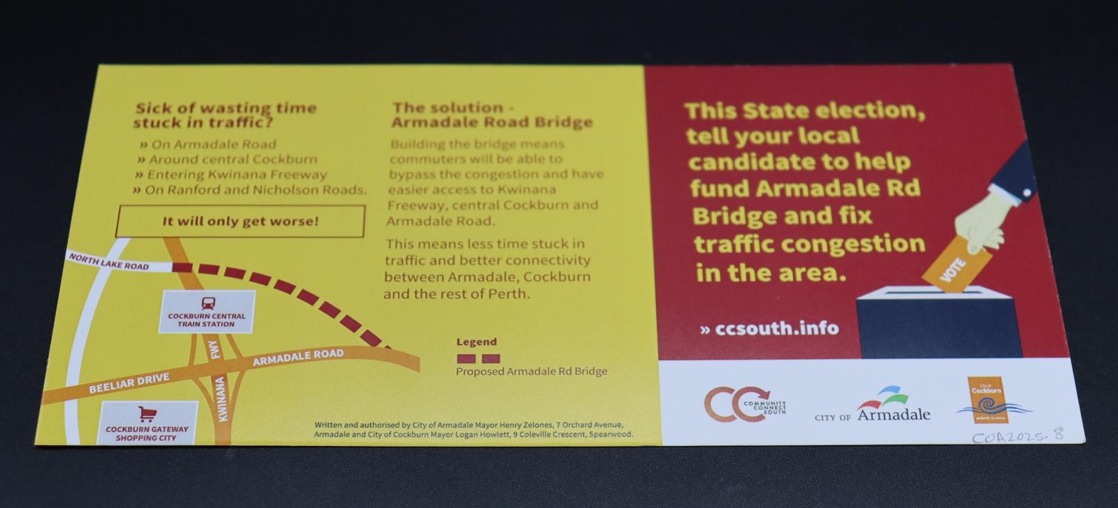The rear side of a rectangular, DL sized flyer, 2/3 of which is coloured yellow (with red text) and the remaining third mostly coloured dark red (with yellow text), with a small white strip making up the bottom of the red section.