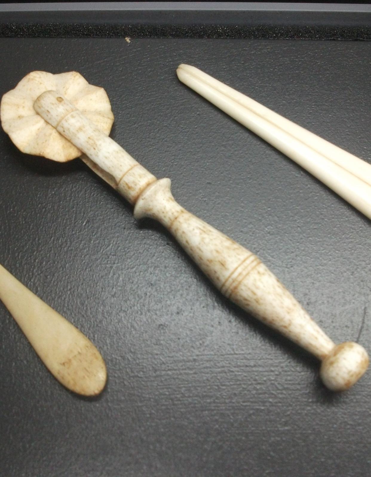 Jagging wheel carved from whale bone.
