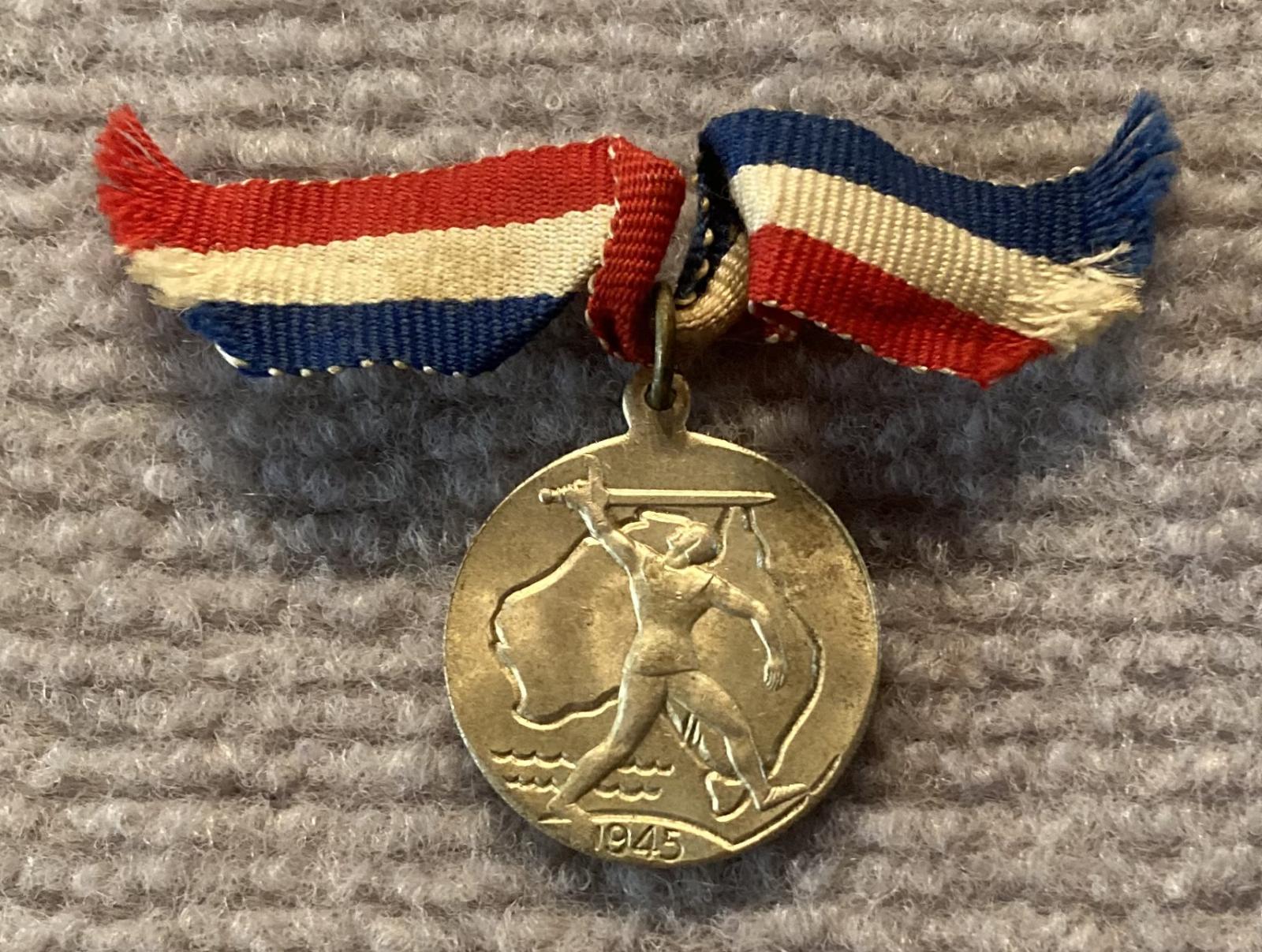 Obverse of 1945 Commemorative Victory Medal - silver with ribbon