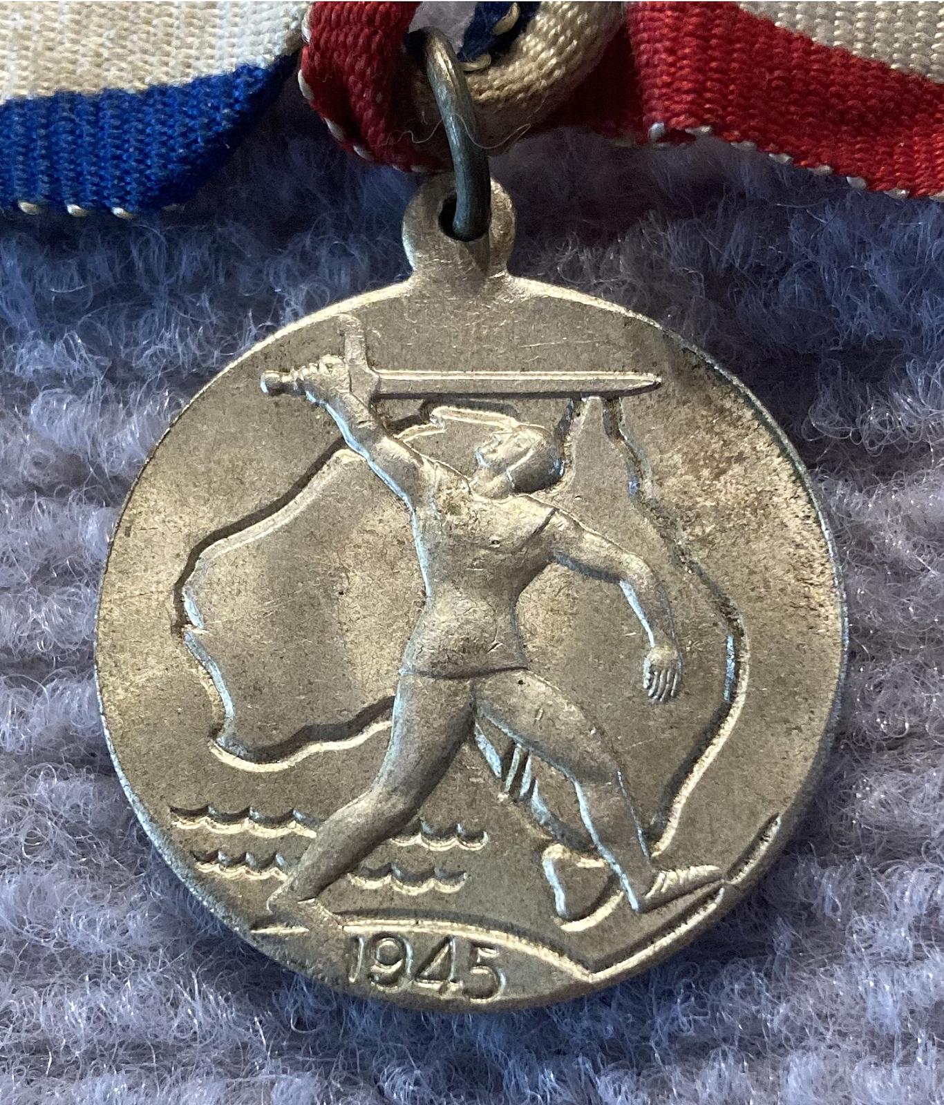 Close up of obverse of 1945 Commemorative Victory Medal - silver 