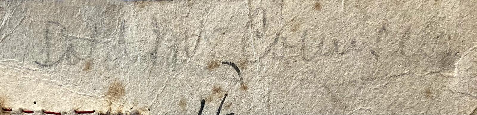 Close up of writing on reverse of tag