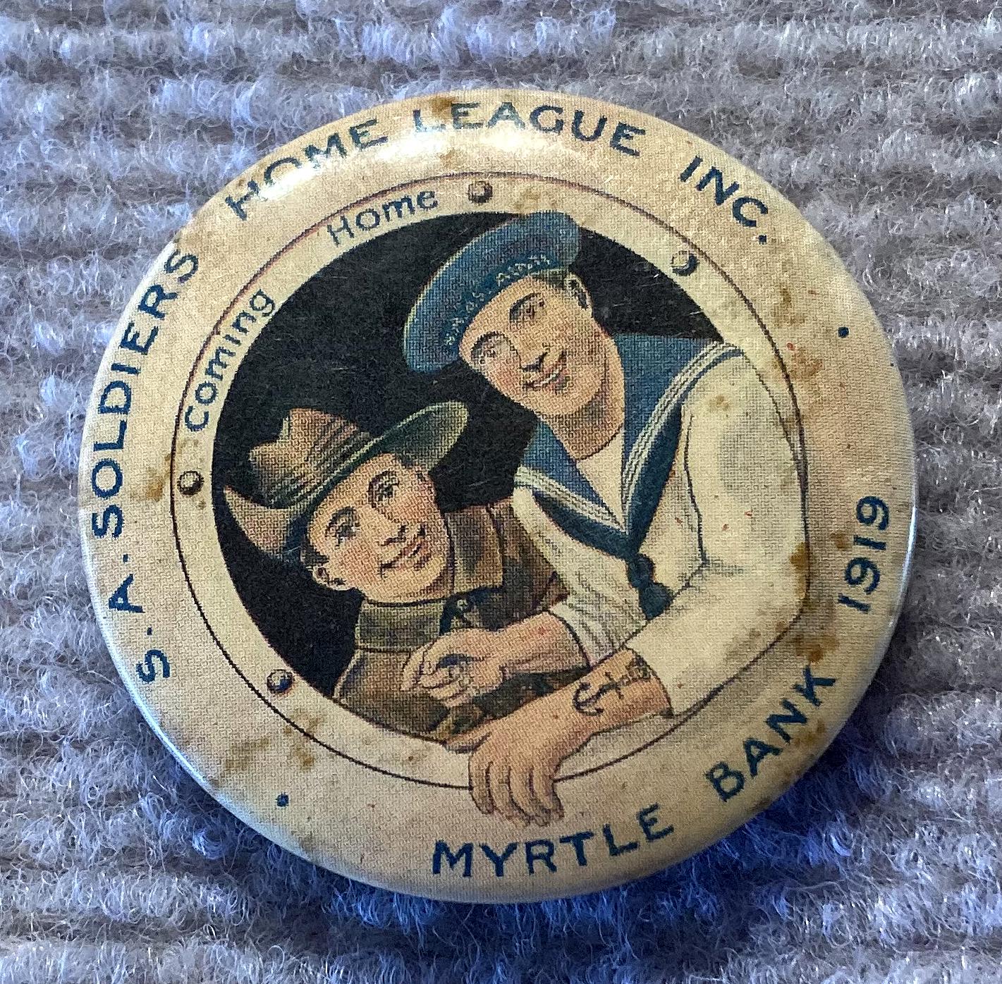 Other angled view of S.A. Soldiers Home League Inc. large fundraising badge/button 