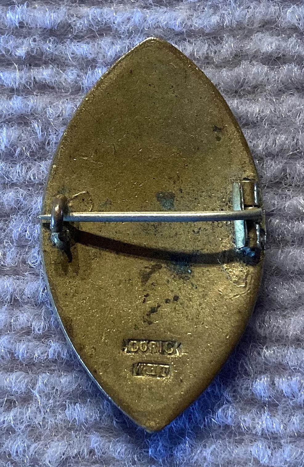Reverse of WWI era French Wounded Emergency Fund enamel fundraising badge