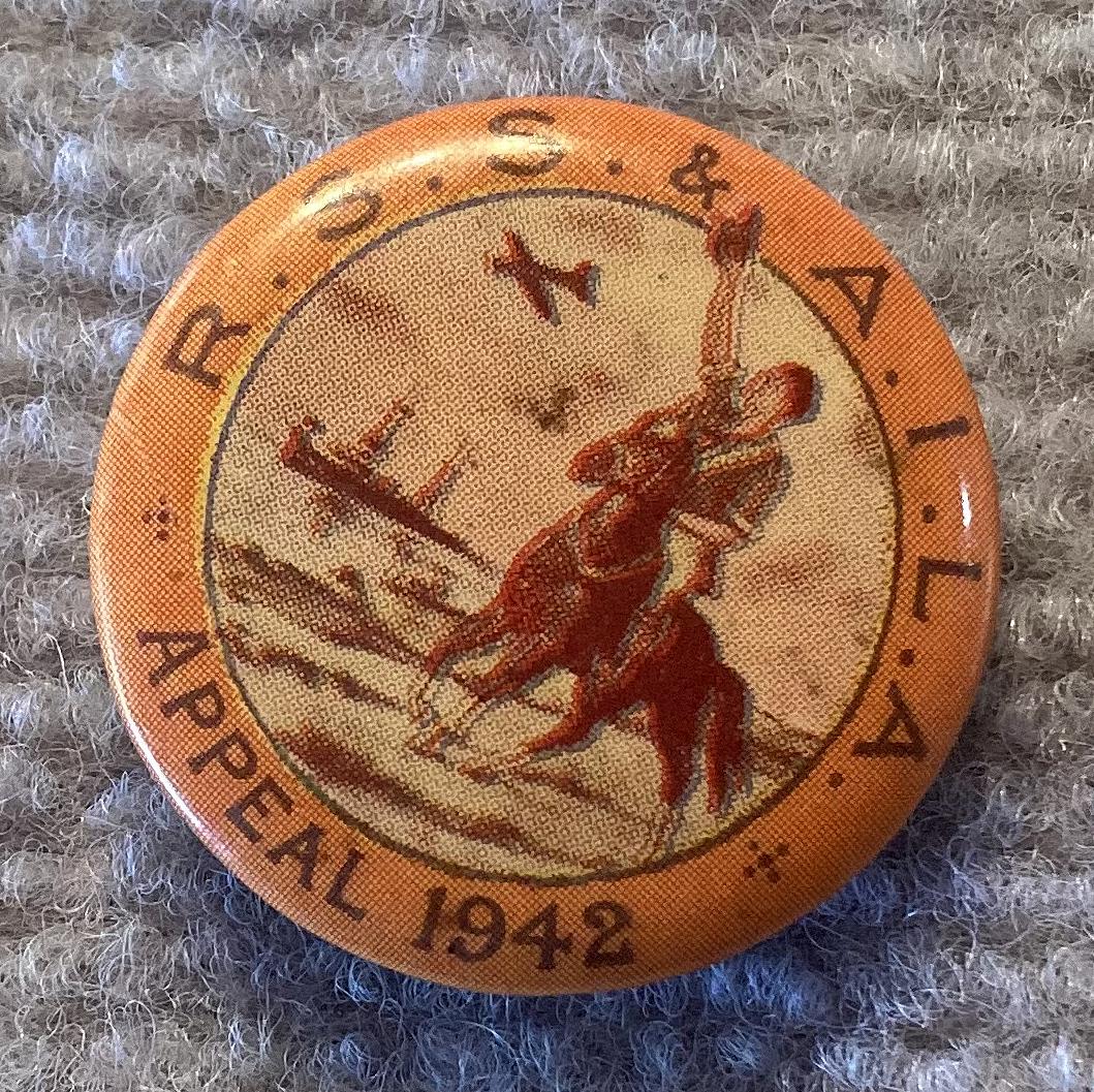 Other angled view of R.S.S. & A.I.L.A. fundraising badge/button - 1942