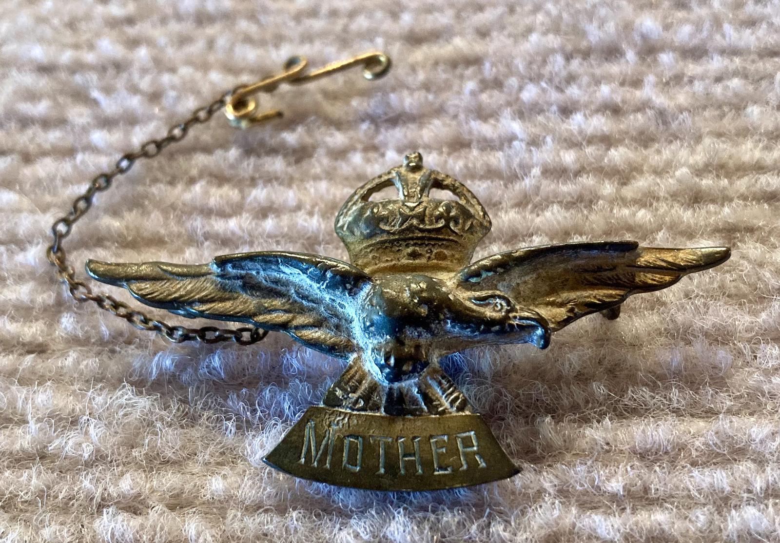 Oblique view of WWII era Air Force sweetheart brooch engraved to 'Mother'