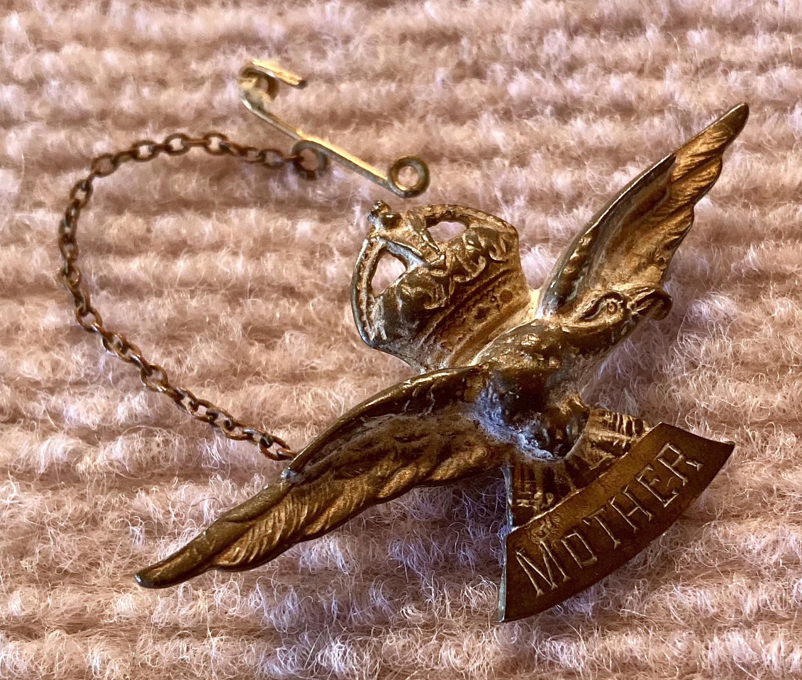 Angled view of WWII era Air Force sweetheart brooch engraved to 'Mother'