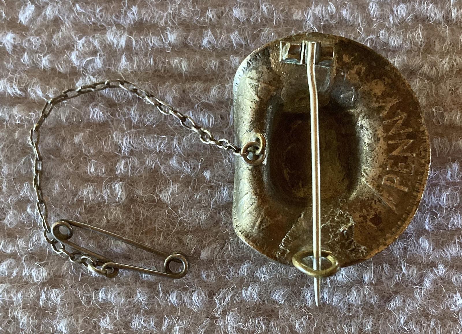 Reverse of silvered 1943 Australian Penny slouch hat sweetheart brooch 
