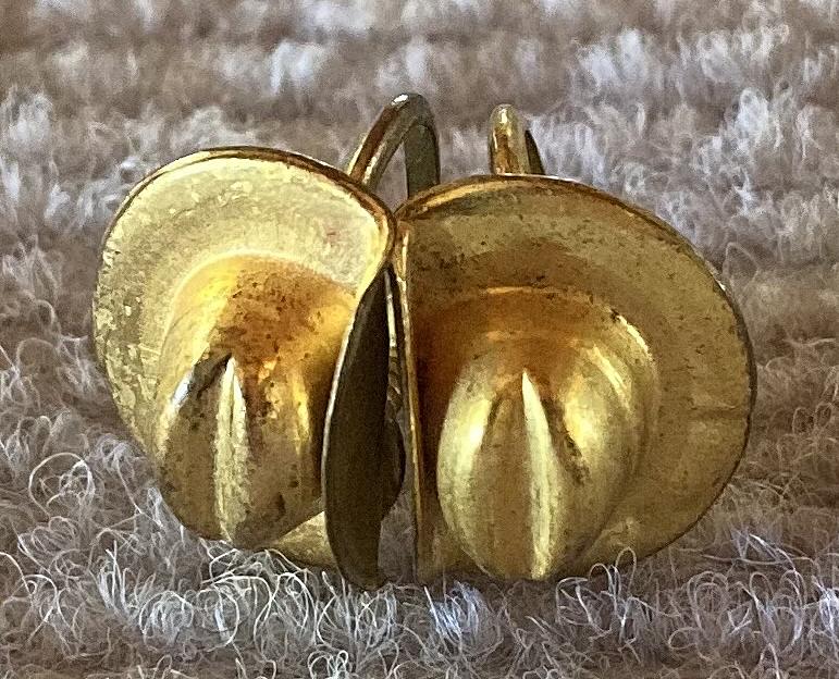 Top view of gold tone slouch hat screw back earrings