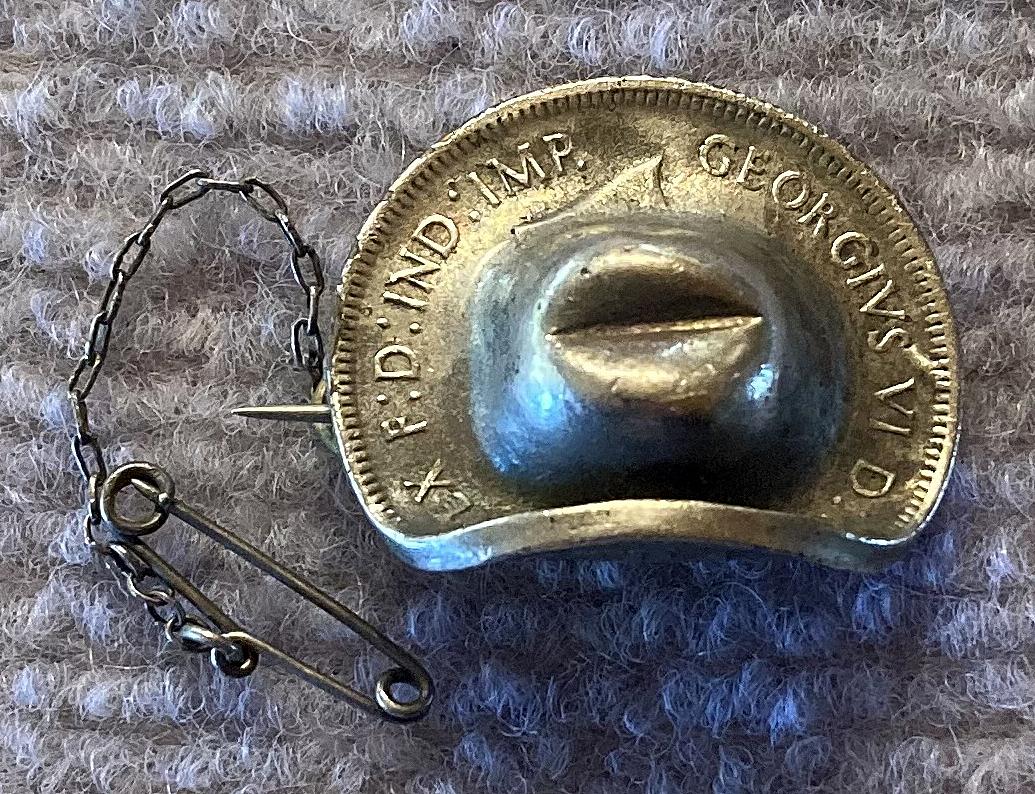 Side view of silvered 1943 Australian Penny slouch hat sweetheart brooch 