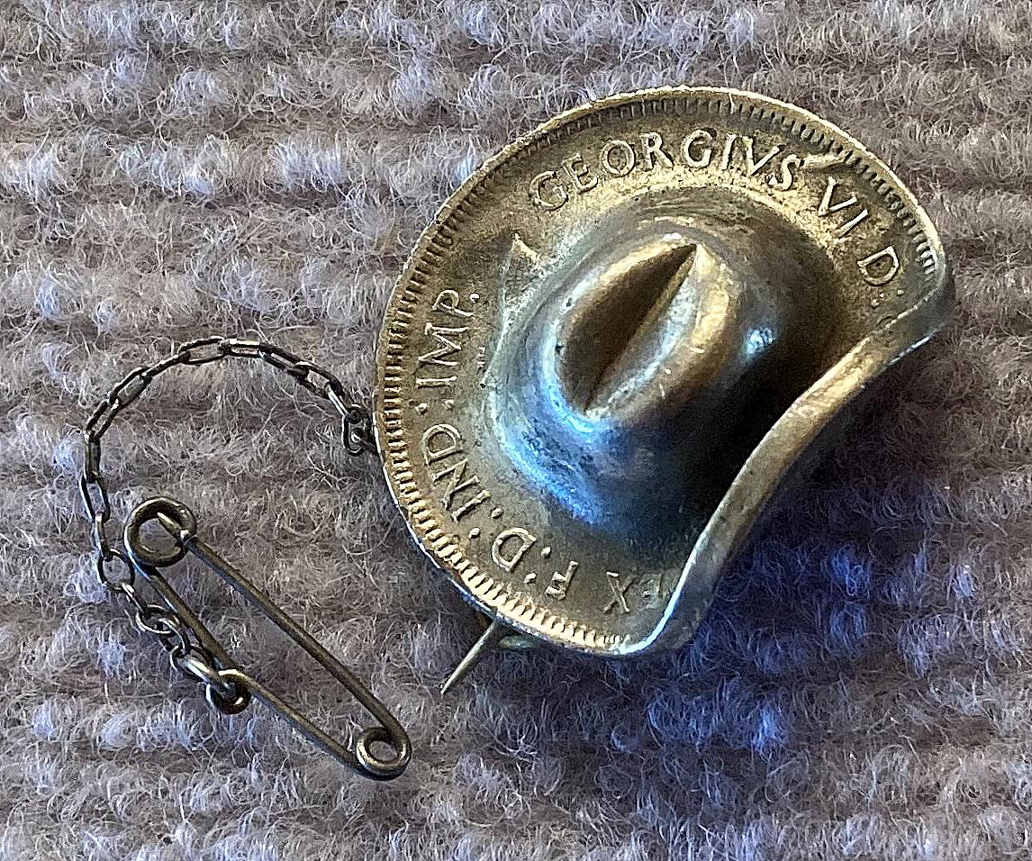 Angled view of silvered 1943 Australian Penny slouch hat sweetheart brooch 