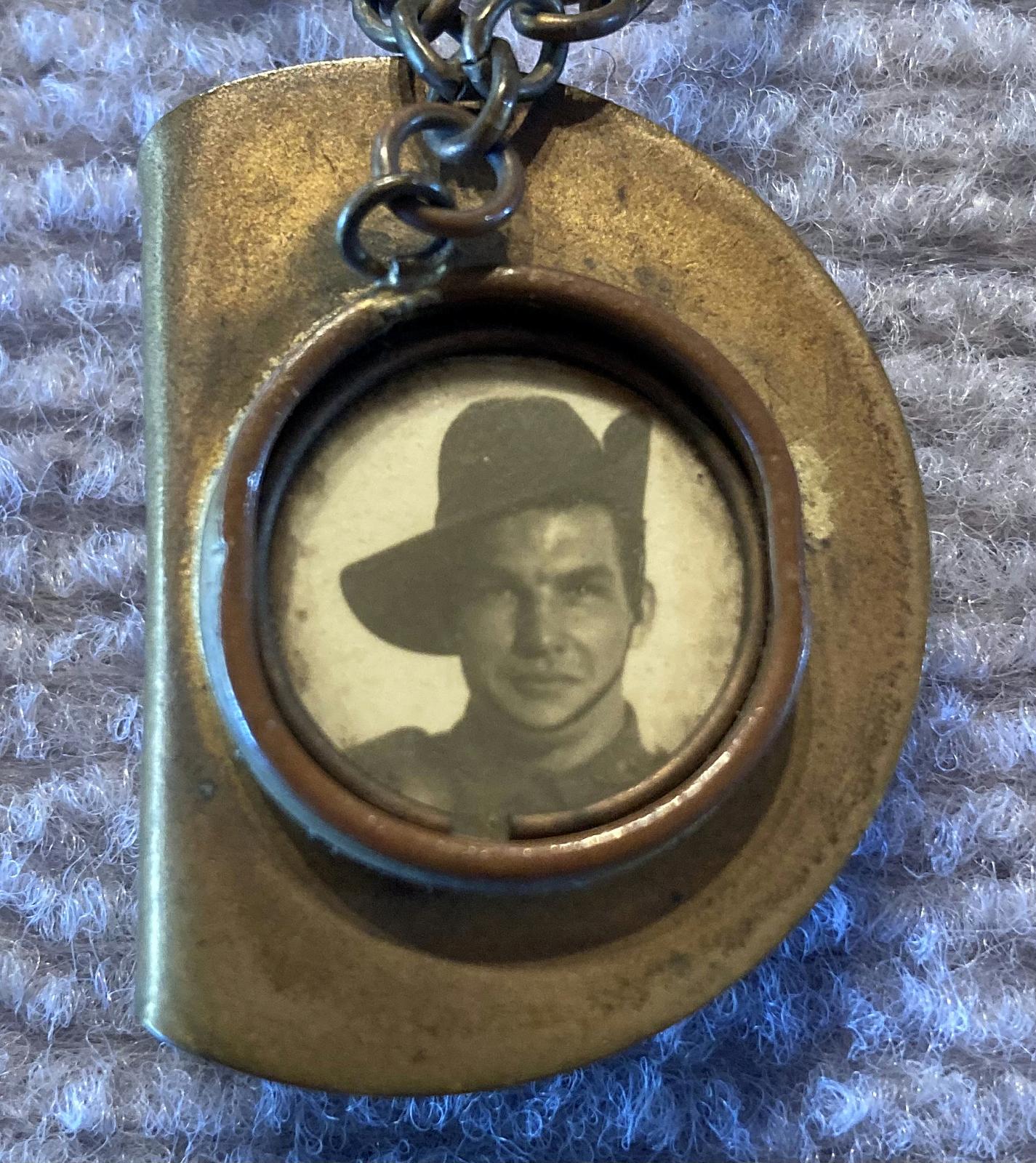 Close up of slouch hat sweetheart brooch containing soldier portrait - 1