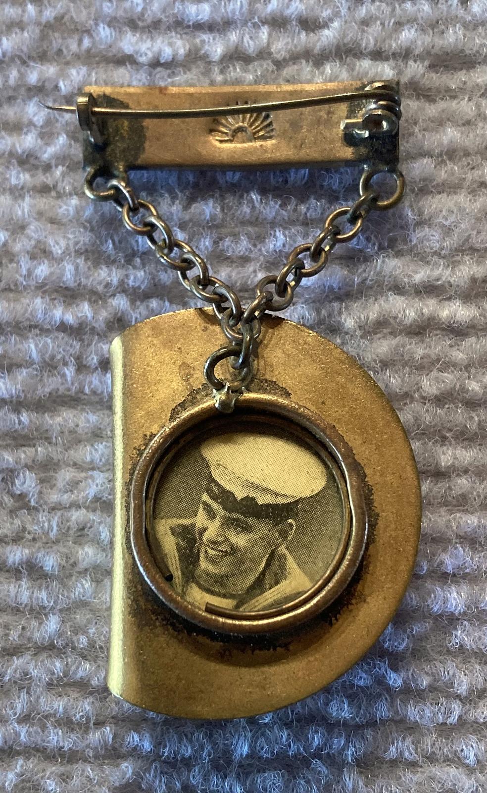 Slouch hat sweetheart brooch containing sailor portrait 