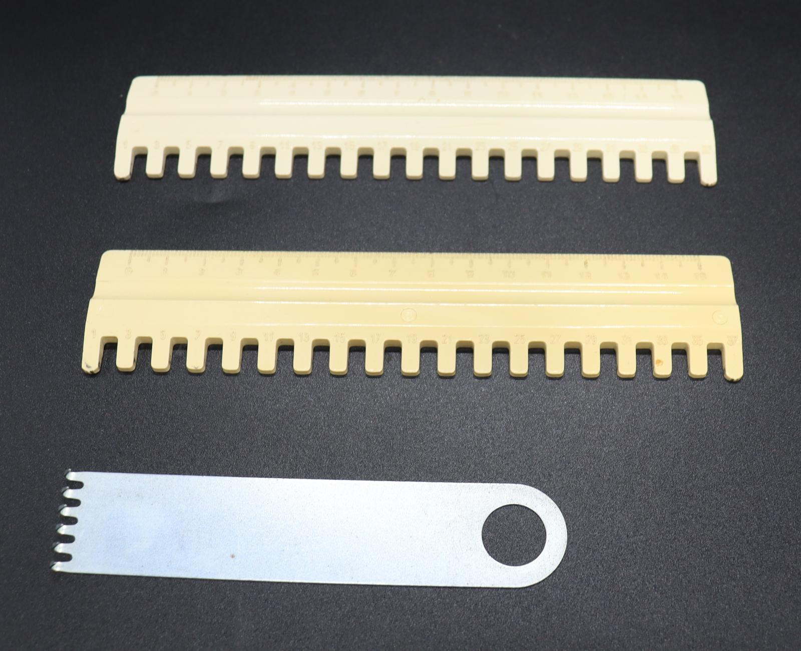 The spare parts for a BROTHER KH-892 Knitting Machine. 2 plastic combs with square teeth on the long side, and 1 metal comb with teeth on the short side and a hole at the opposite end.