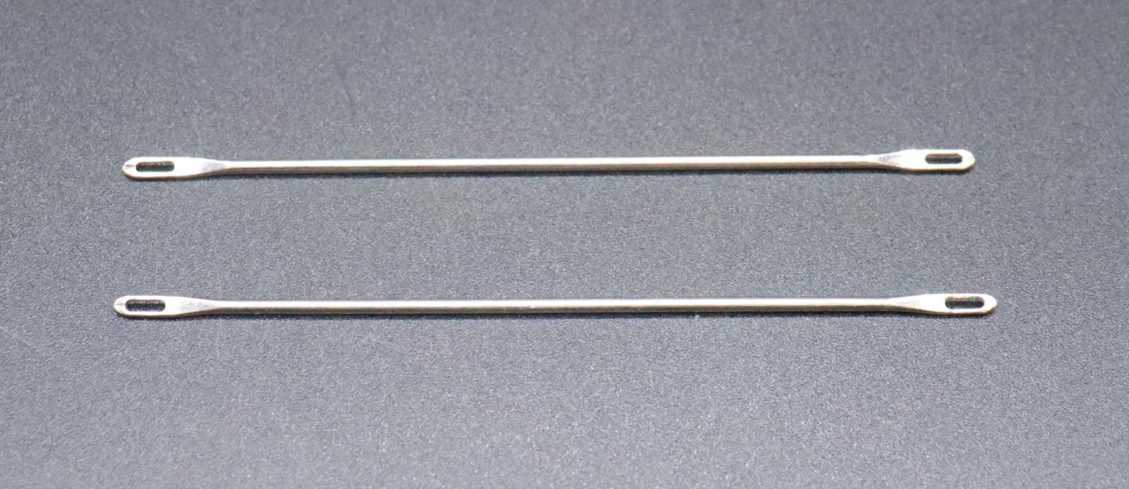 2 short, metal needles with closed loops at each end.