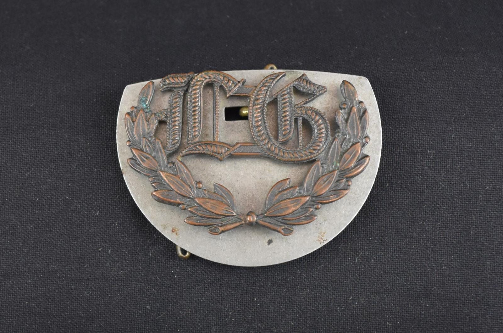 Lewis Gunner Brass Badge as issued to Charles Frederick JACKMAN, W17457