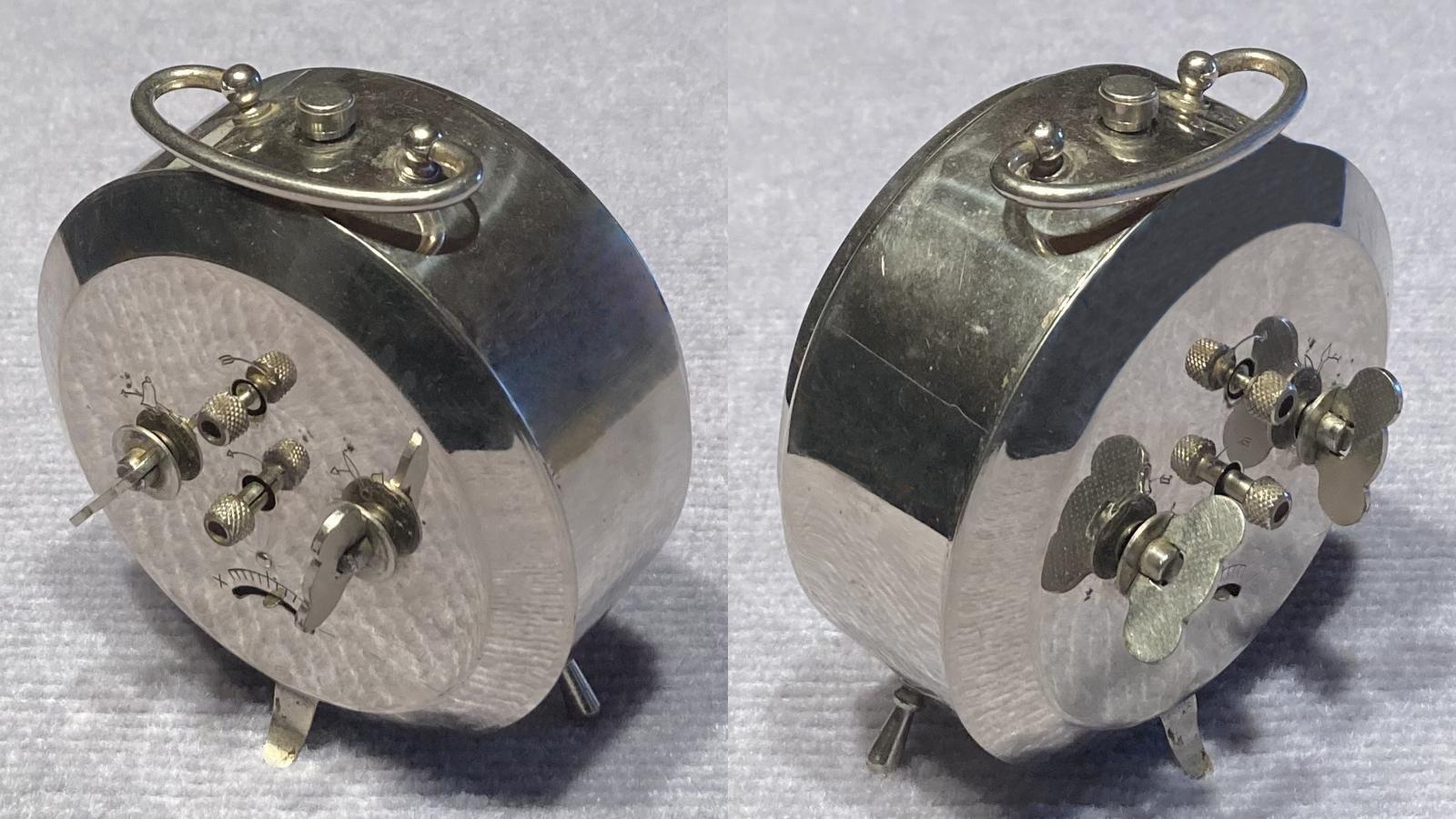 Angled view of back of Commonwealth of Australia alarm clock 