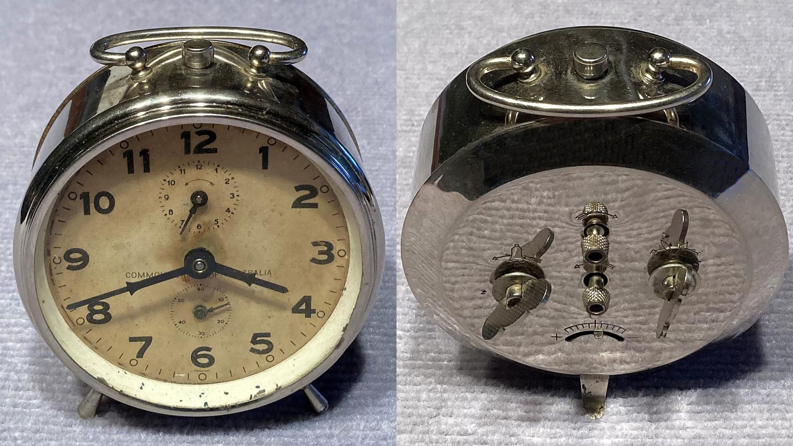 Commonwealth of Australia alarm clock - front and back from side