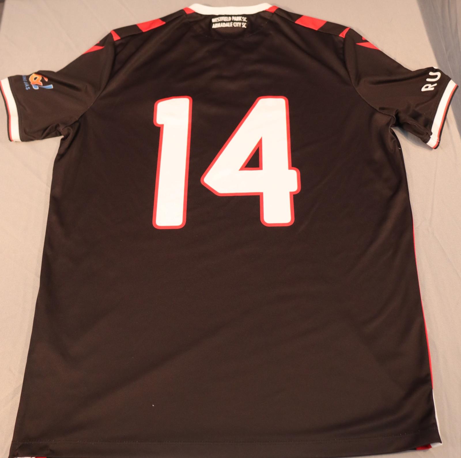 The rear of the shirt is a solid black background, with a white neckline, [WESTFIELD PARK SC / ARMADALE CITY SC] written just below it. In the middle of the back is a lage white number 14 with red outline. 