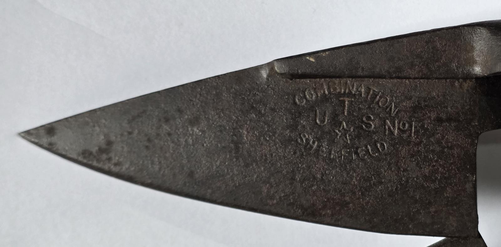 Trade mark detail on right hand outside blade
