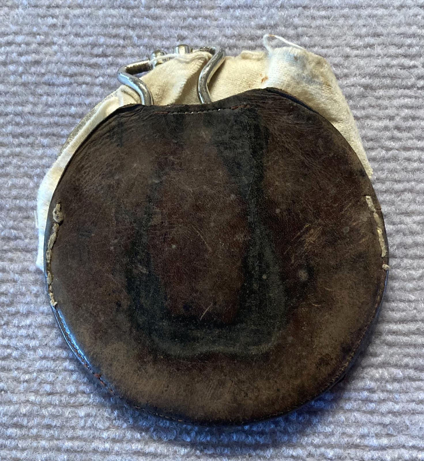 WWI shaving mirror packed inside cloth and leather covers