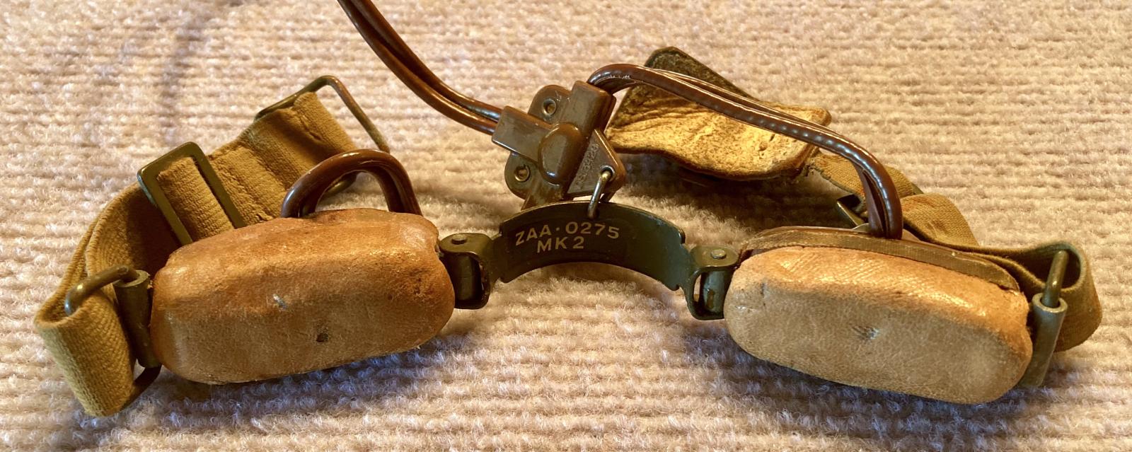 Close up of WWII Air Force throat microphone showing serial number