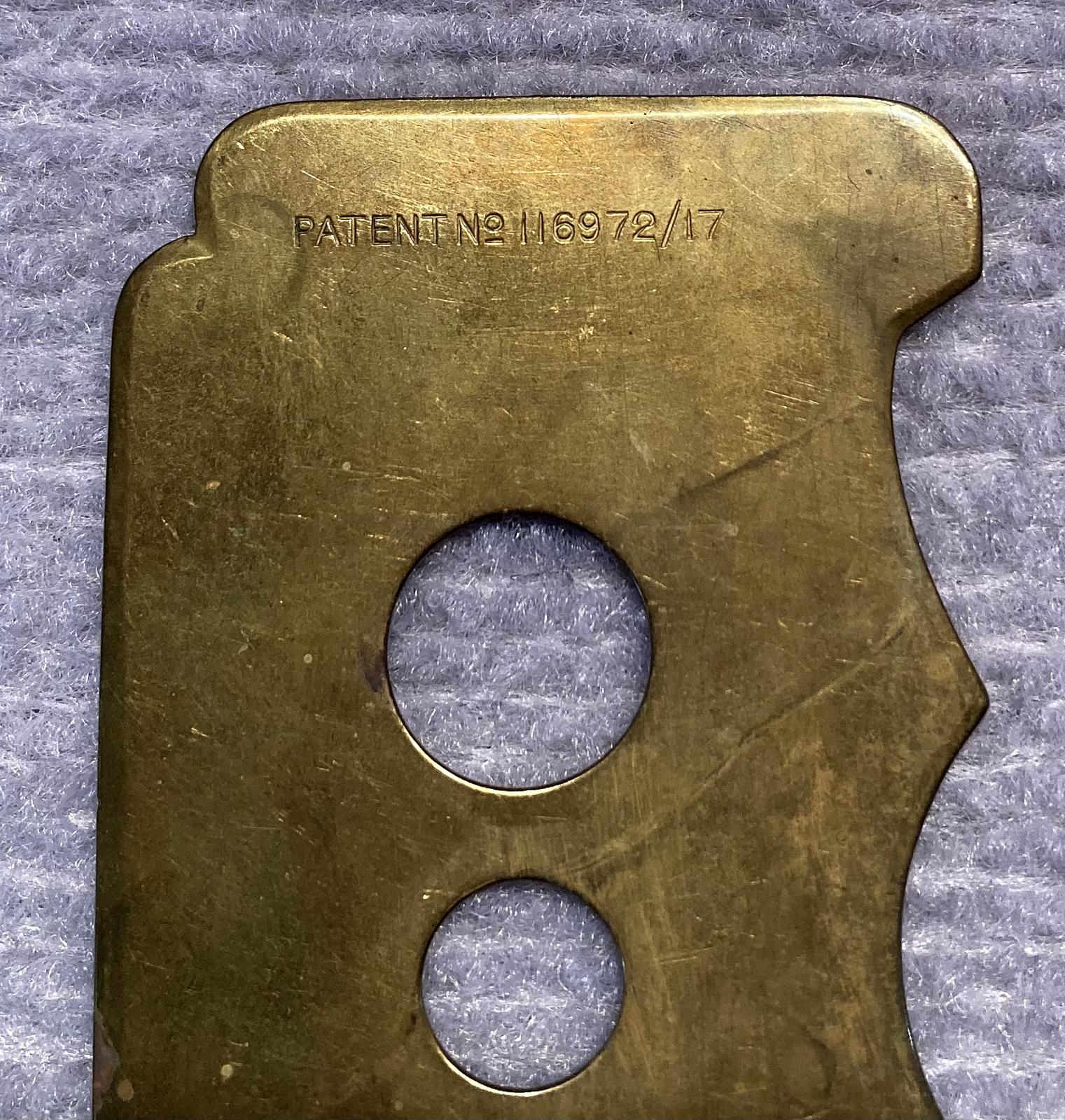 Close up of WWI era brass button stick - type 2