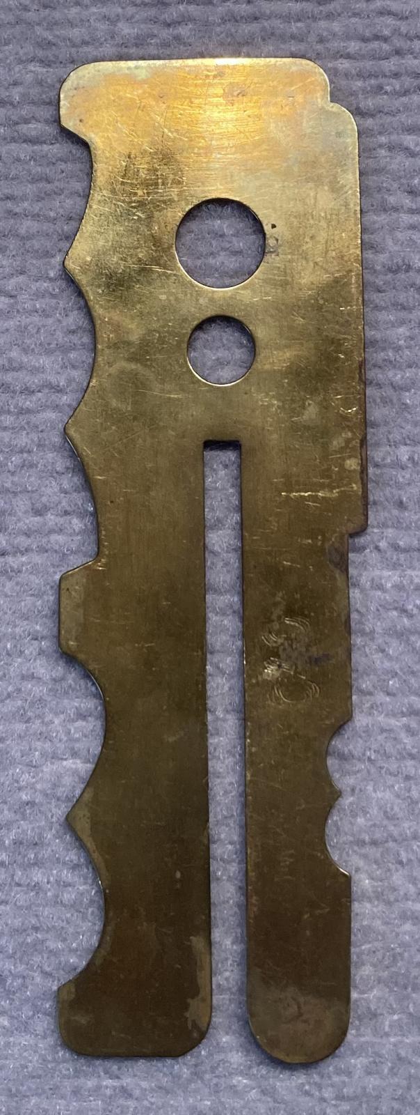 Reverse of WWI brass button stick - type 2