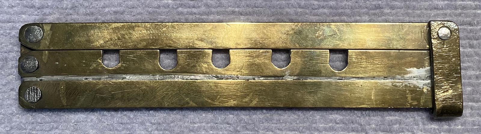 Hand made WWI hinged brass button stick - closed