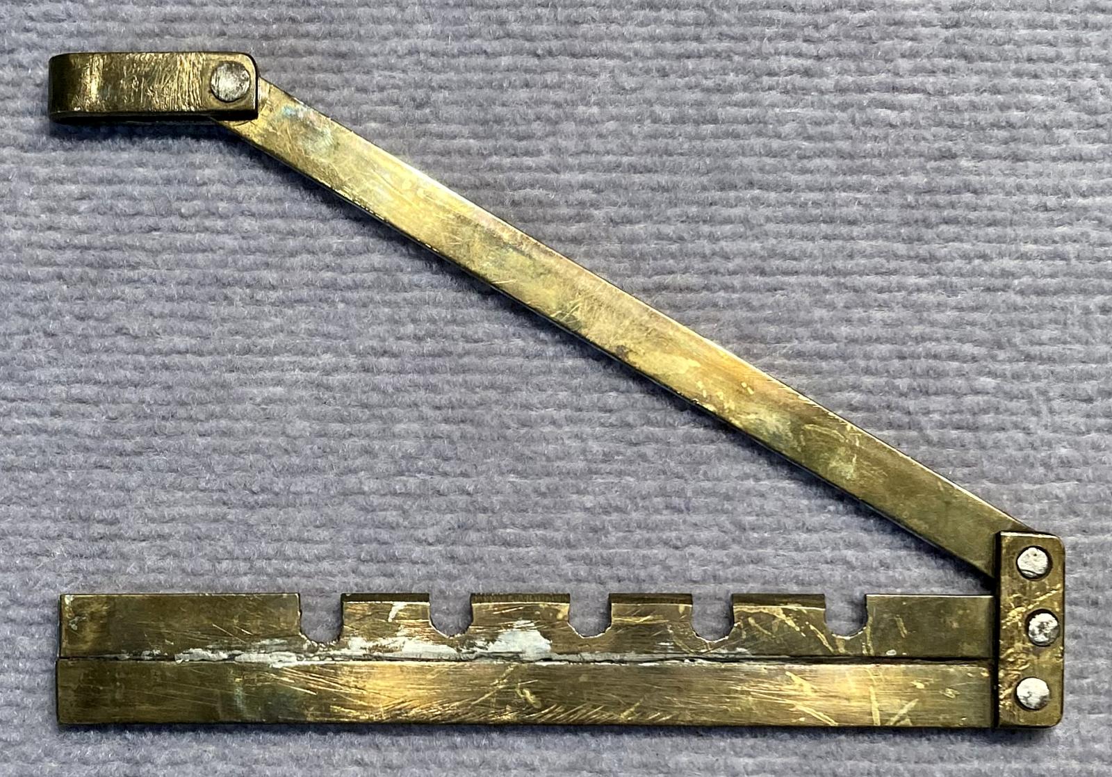 Other side of hand made WWI hinged brass button stick - open