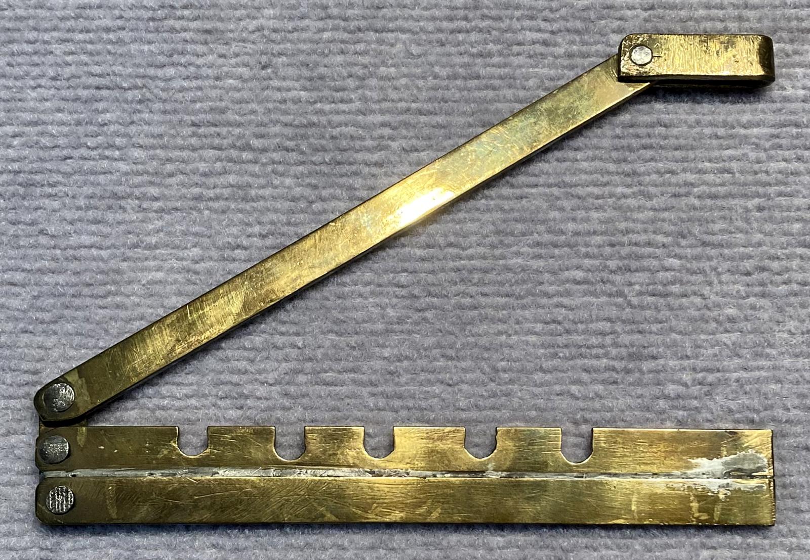 Hand made WWI hinged brass button stick - open