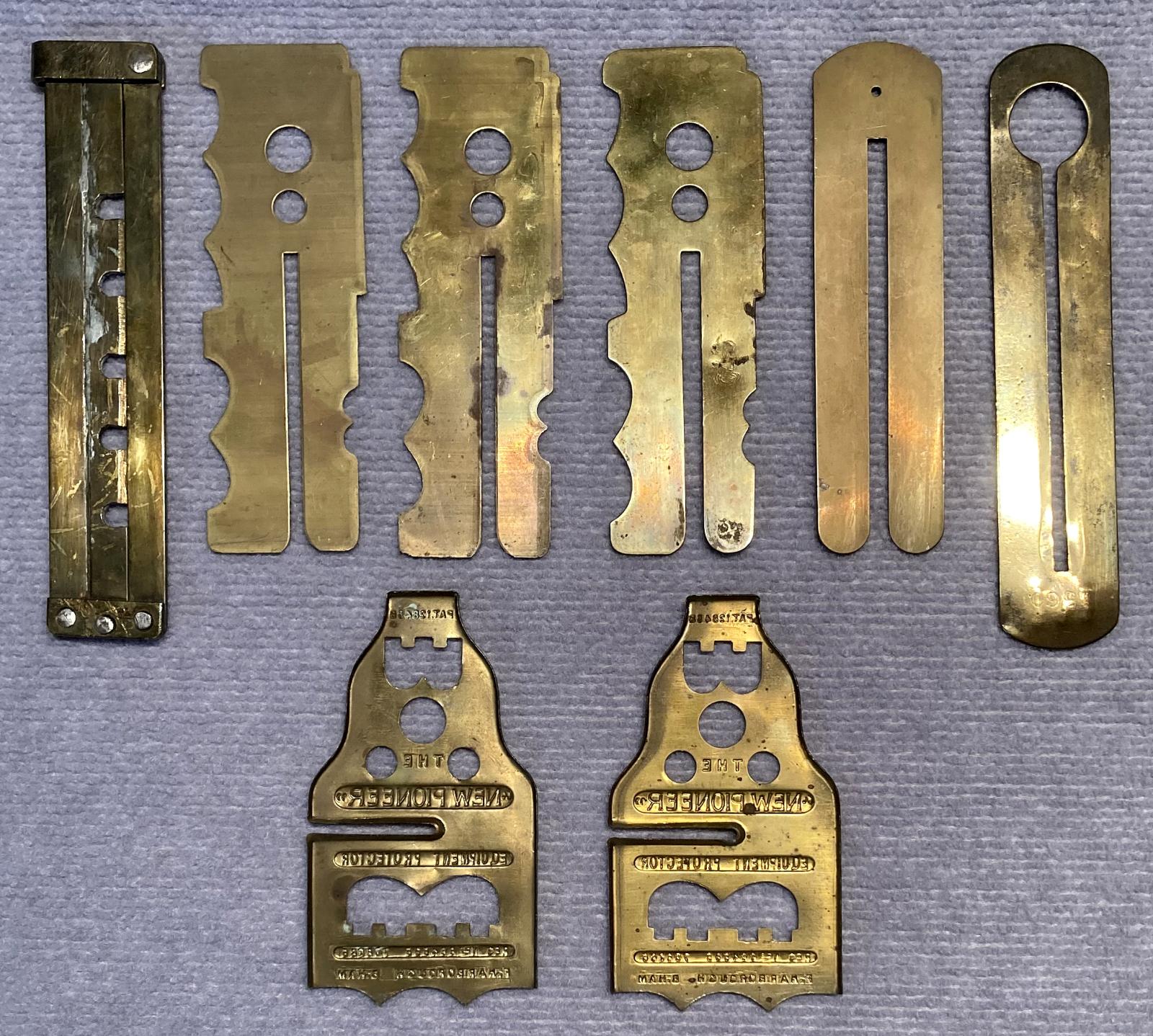 Reverse view of grouping of brass button sticks