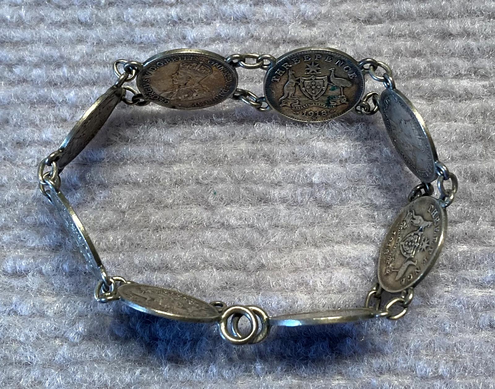 WWI era trench art coin bracelet as worn